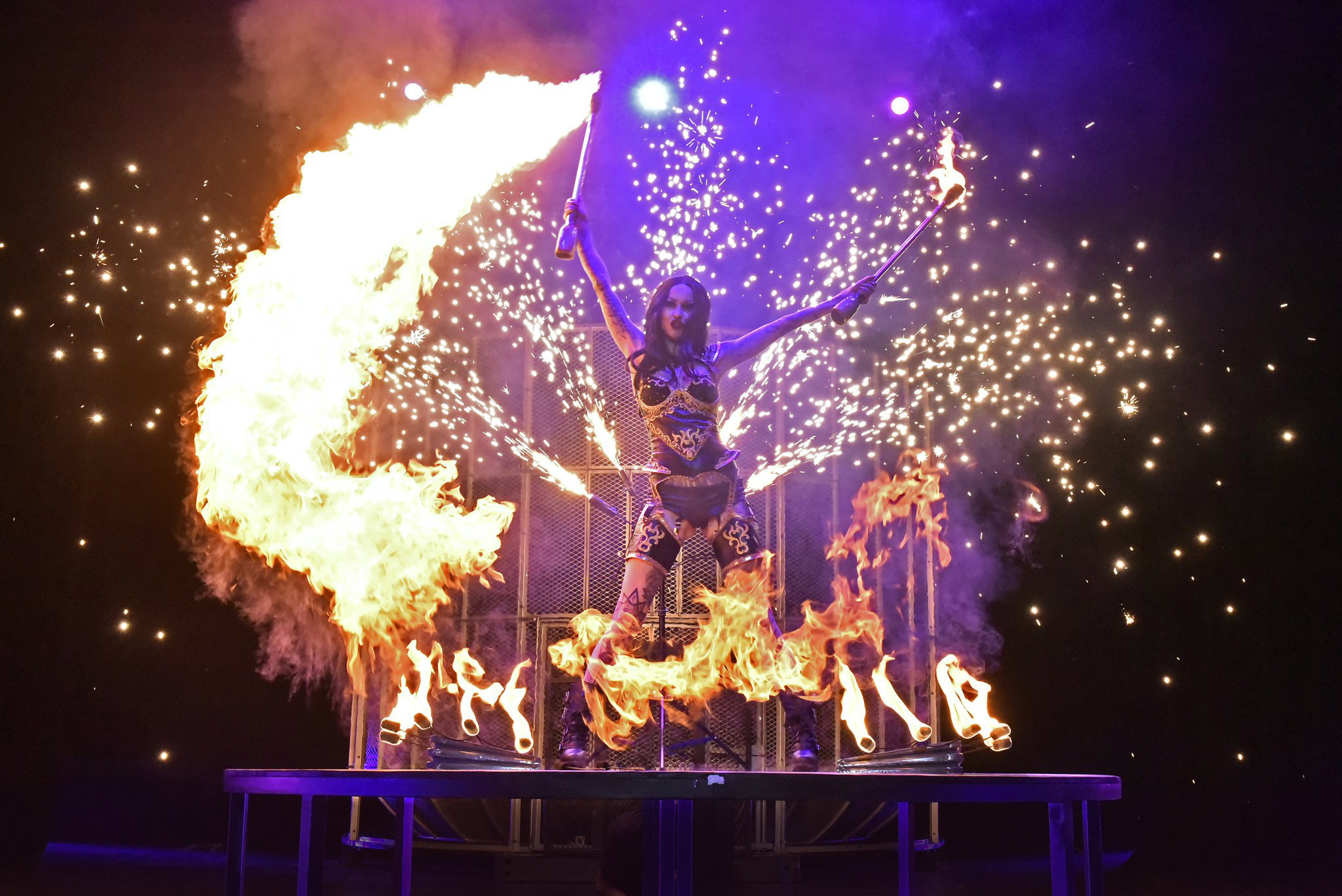 Shelly d’Inferno performing her dragon canes act.