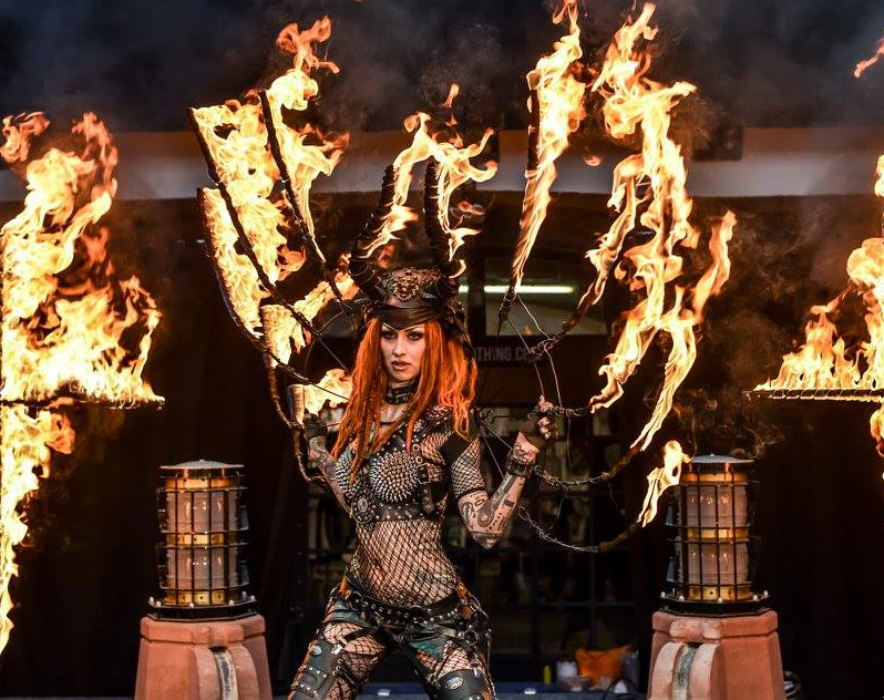 Shelly d’Inferno performing her burning wings act.