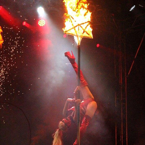 Gem Dee performing her flaming pentagram act.